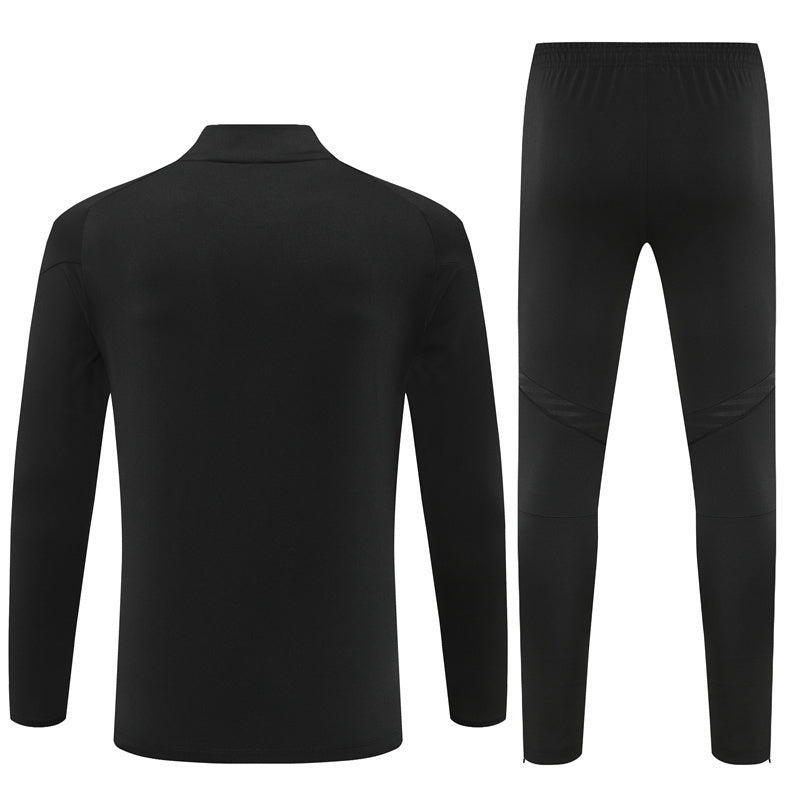 Survetement-Real-Madrid-Training-2025-2026-Noir-Orange-Camouflage-2